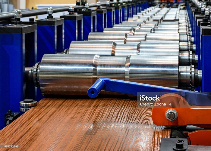 Several roll stands configured to corrugate painted and embossed sheet metal panels - MP Metals